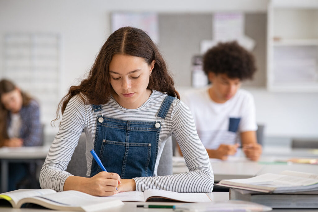 IELTS One Skill Boost student studying for IELTS exam with focus on reading and writing practice
