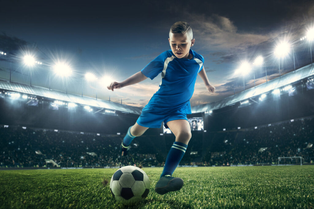 Young boy training in a stadium during the English Football Course Hua Hin, part of the Premier Skills programme combining football coaching and English learning