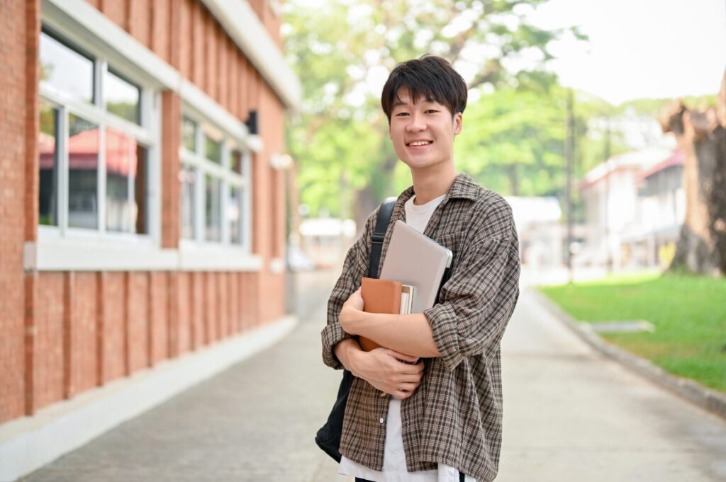 IELTS One Skill Boost Hua Hin student holding books and preparing for the IELTS test