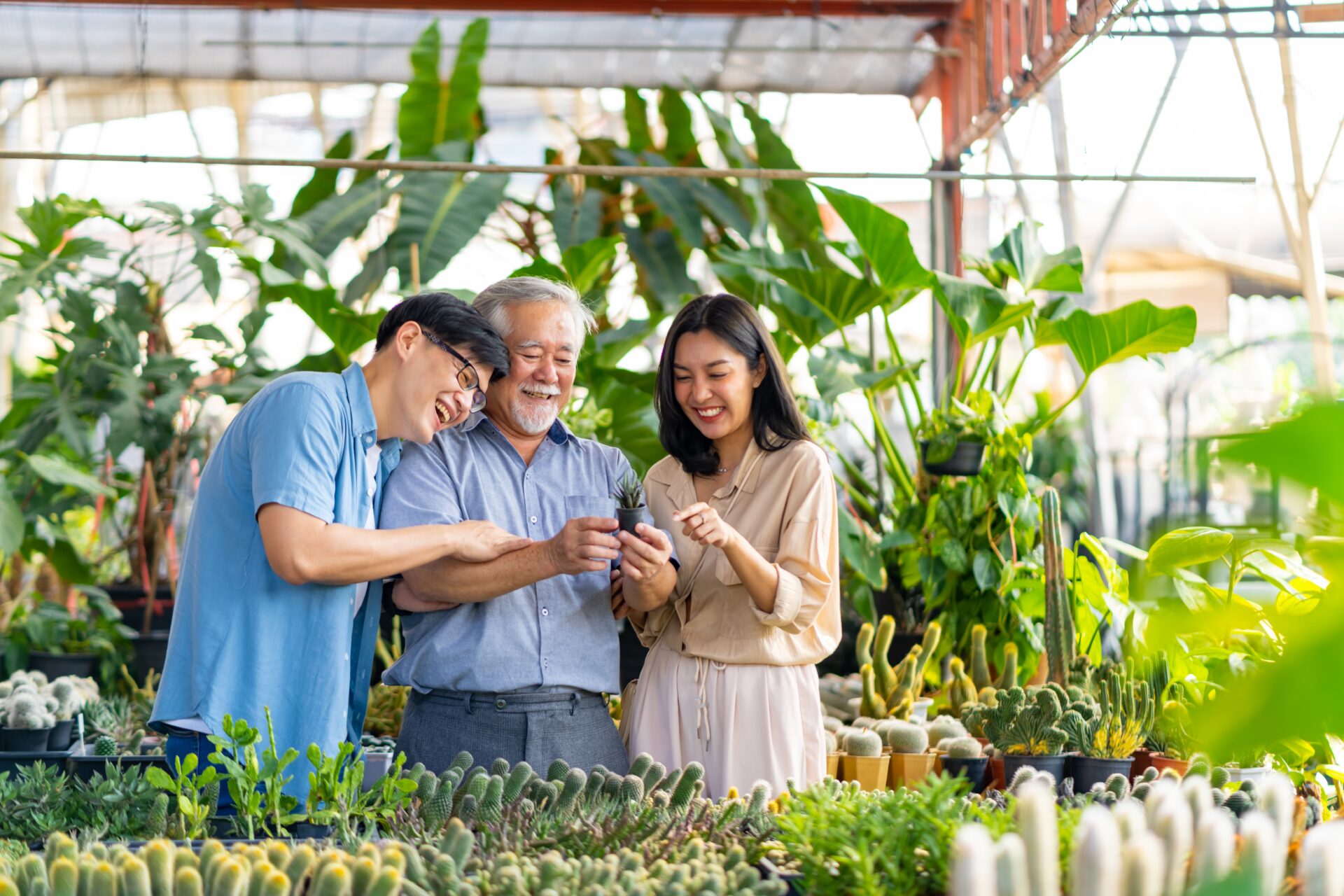 IELTS Family and Relationships in Thailand 2025 – three generations of a Thai family bonding while gardening together.