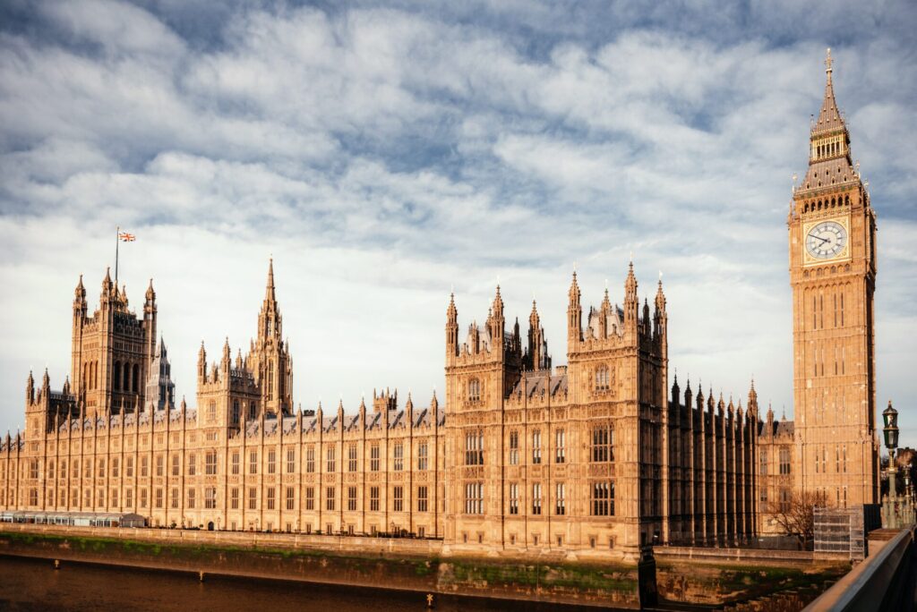 UK Parliament in London, symbol of democracy and political power, ideal image for IELTS Politics and Government themes about freedom, corruption, and authority.