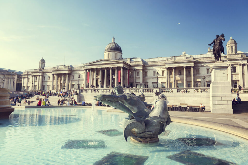 IELTS Art and Heritage: view of the National Gallery in London with fountains and statues in Trafalgar Square, symbolising museums and cultural history.