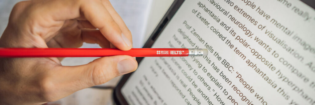 IELTS course in Hua Hin: The Essential 6 Ways Coaching Turns Mistakes into Momentum 1 IELTS course in Hua Hin pencil held over reading text during study at ILC Hua Hin.