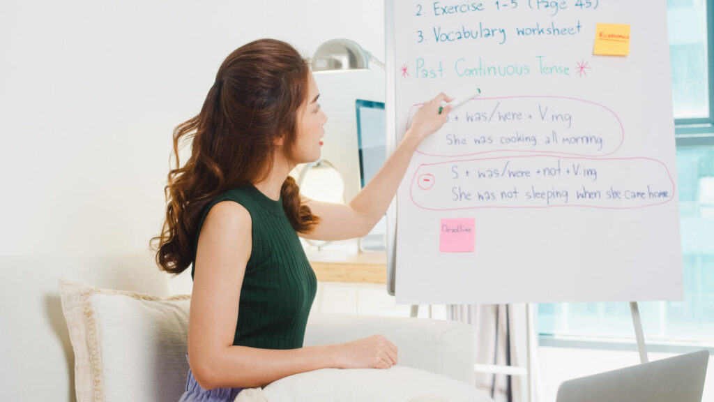 Teacher explaining English grammar during a coaching session for Trinity GESE in Hua Hin at ILC.