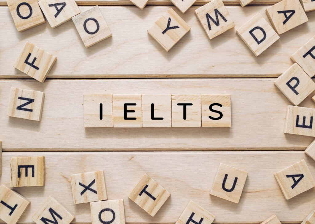 Boost your IELTS Score: 1 Boost your IELTS Score wooden letter tiles arranged on a table representing exam preparation at ILC Hua Hin